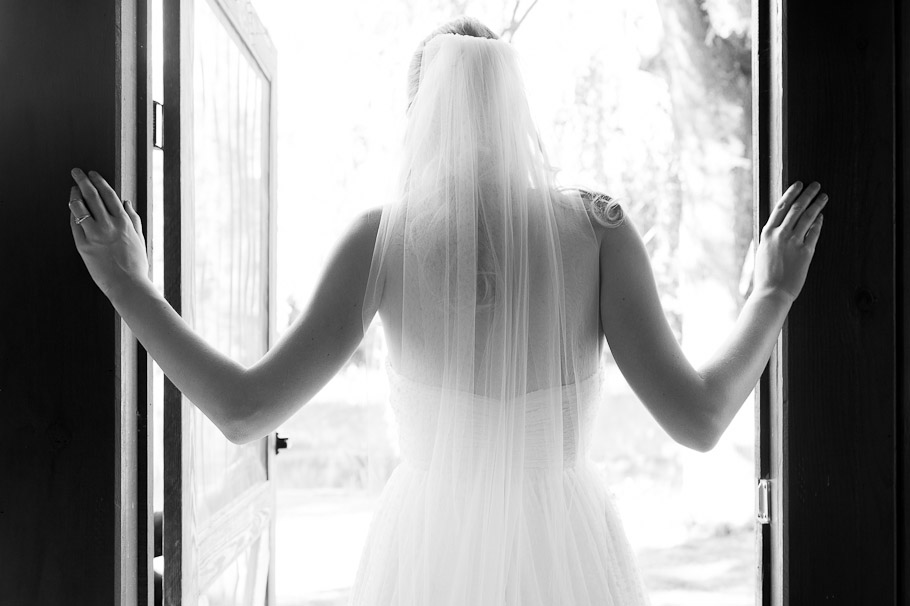 Wedding dress and veil shot from the back in the honeymoon cabin.