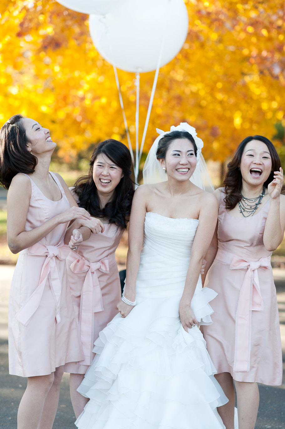Bride and bridesmaids candidly enjoying themselves