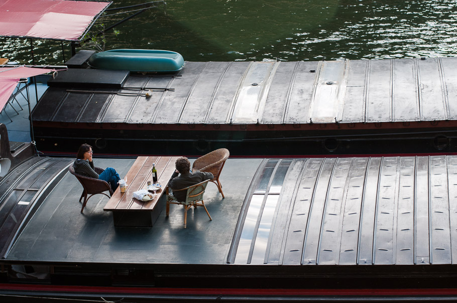 Laid back Parisian life having bread and wine on floating homes