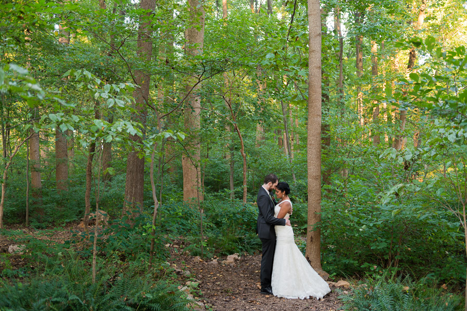 The newly weds getting cozy in the woods